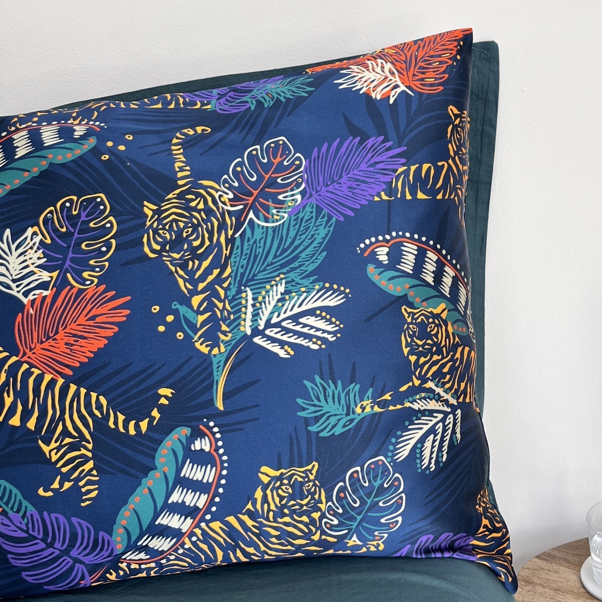 Tiger print silk pillowcase on a bed