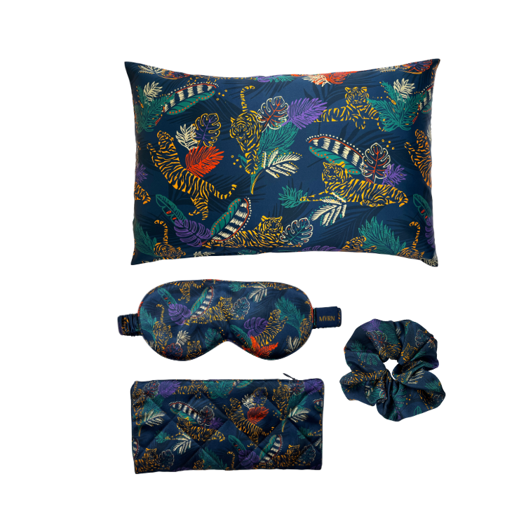 Tiger print silk pillowcase, silk eye mask and scrunchie on a white background
