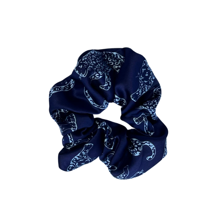 Dark Blue leopard printed silk scrunchie on a white background