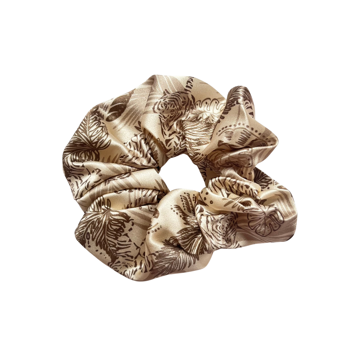 Champagne gold large silk scrunchie with floral tiger print on a white background