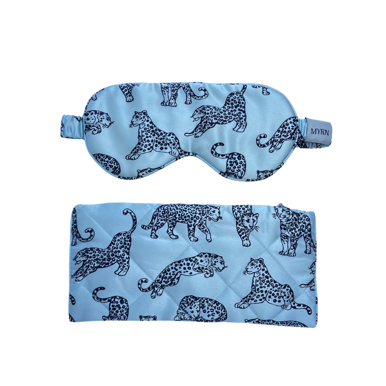 MYRN Silk light blue leopard printed eye mask and silk travel case on a white background