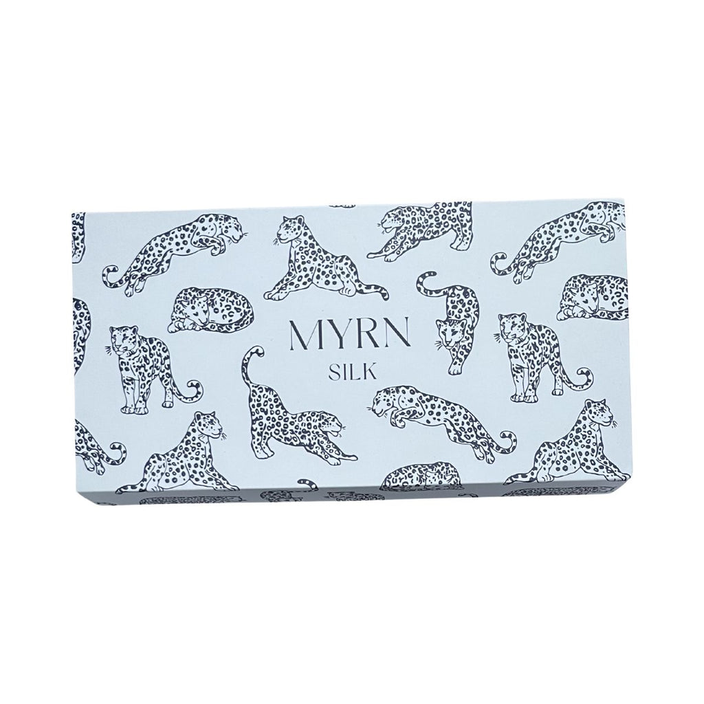 MYRN Silk light blue leopard print branded eye mask box on a white background.