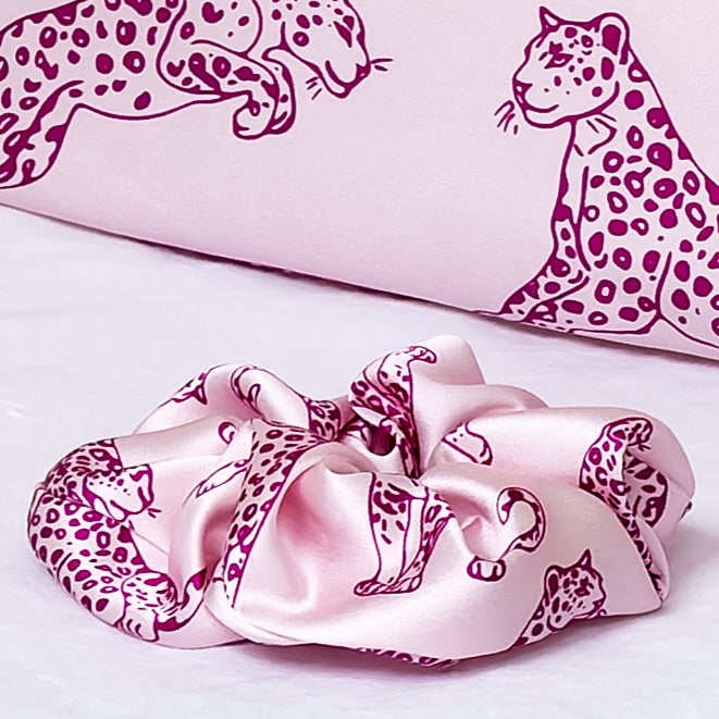 Close up of a pink leopard print pink scrunchie