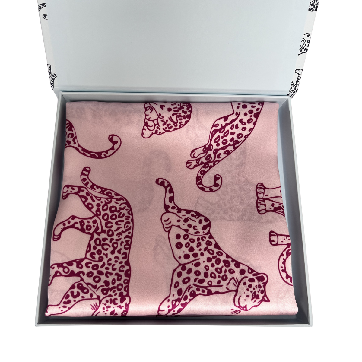 MYRN Silk pink leopard print silk pillowcase folded within a presentation box on a white background.