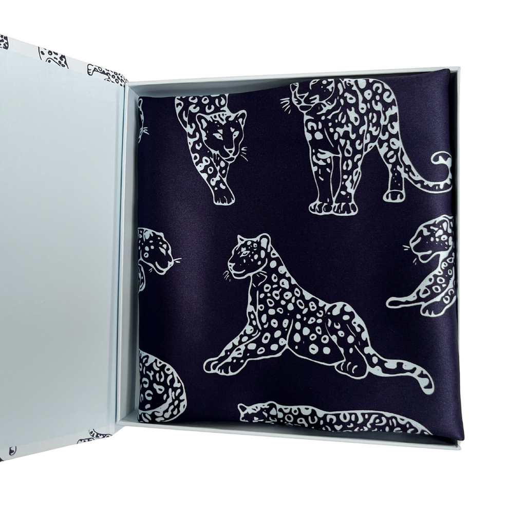 MYRN Silk pink leopard print silk pillowcase folded within a presentation box on a white background.